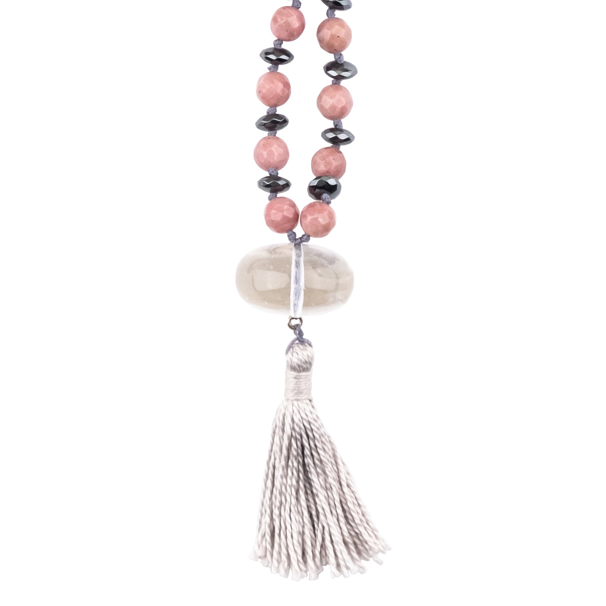 Crystal Clear Quartz pendant of a mala necklace on white background
