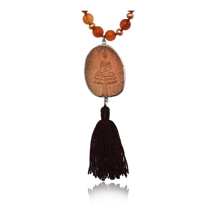 carnelian beads with baby pearls and buddha carved terracotta with tassel of a mala necklace