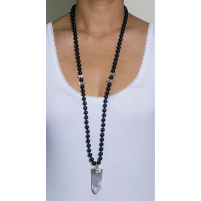 long necklace with frosted onyx beads with herkimer diamond with brandenberg stone set in silver 925 cuttlefish bone casting on model with white top