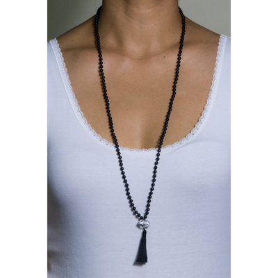 mala necklace with 153 beads 4mm Onyx Frosted with raw Herkimer Diamond pendant and black tassel on model
