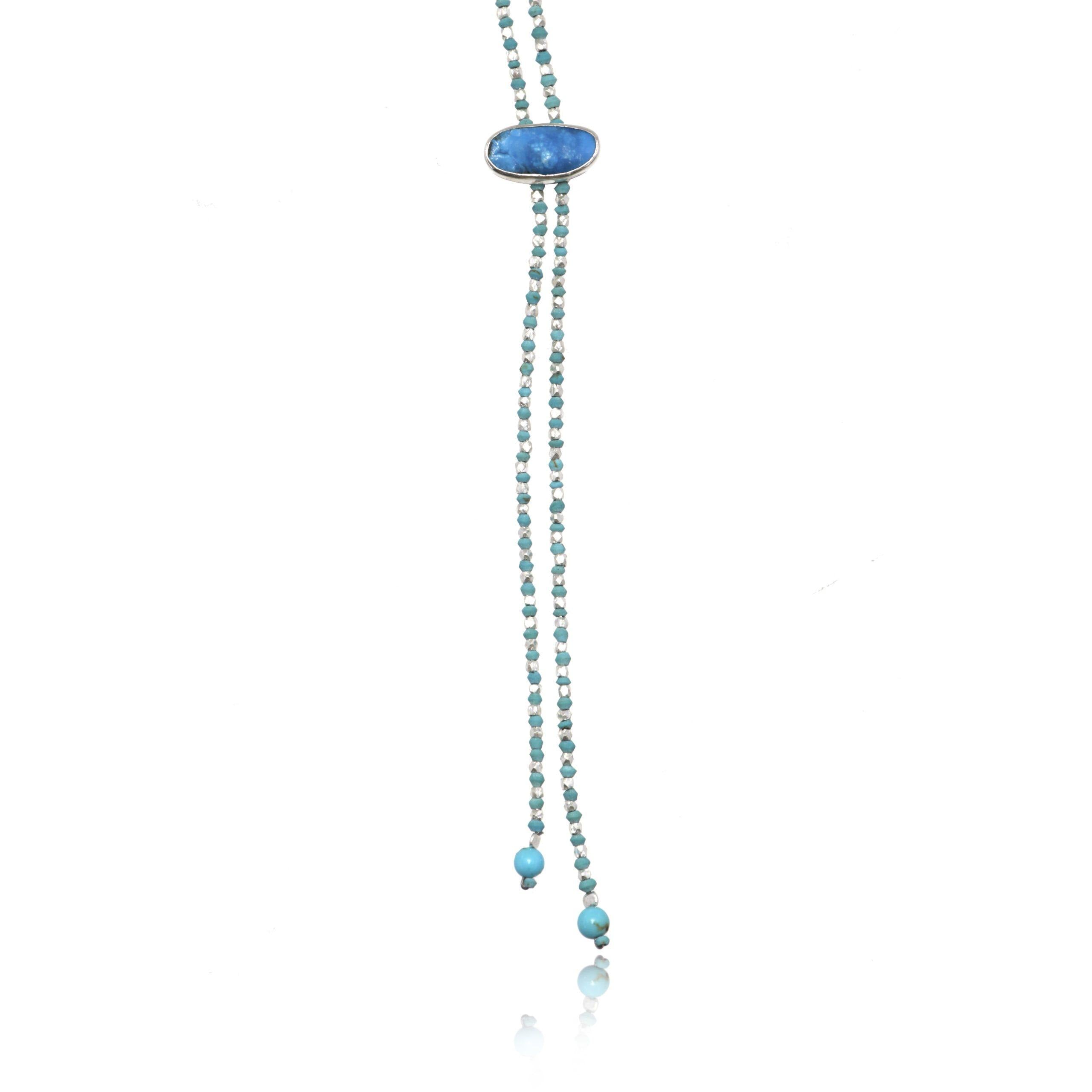 Hemimorphite pendant of a mala necklace on white background