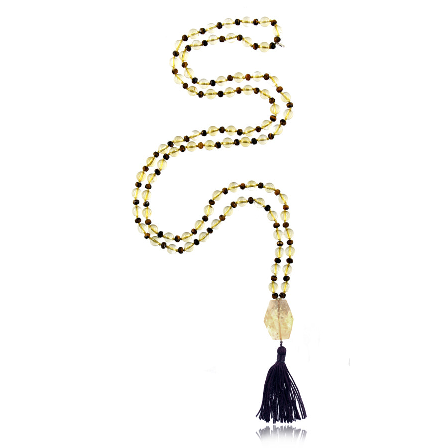 mala necklace with 6 mm citrine and 4 mm faceted tiger eye's beads with citrine pendant and black tassel on white bacground