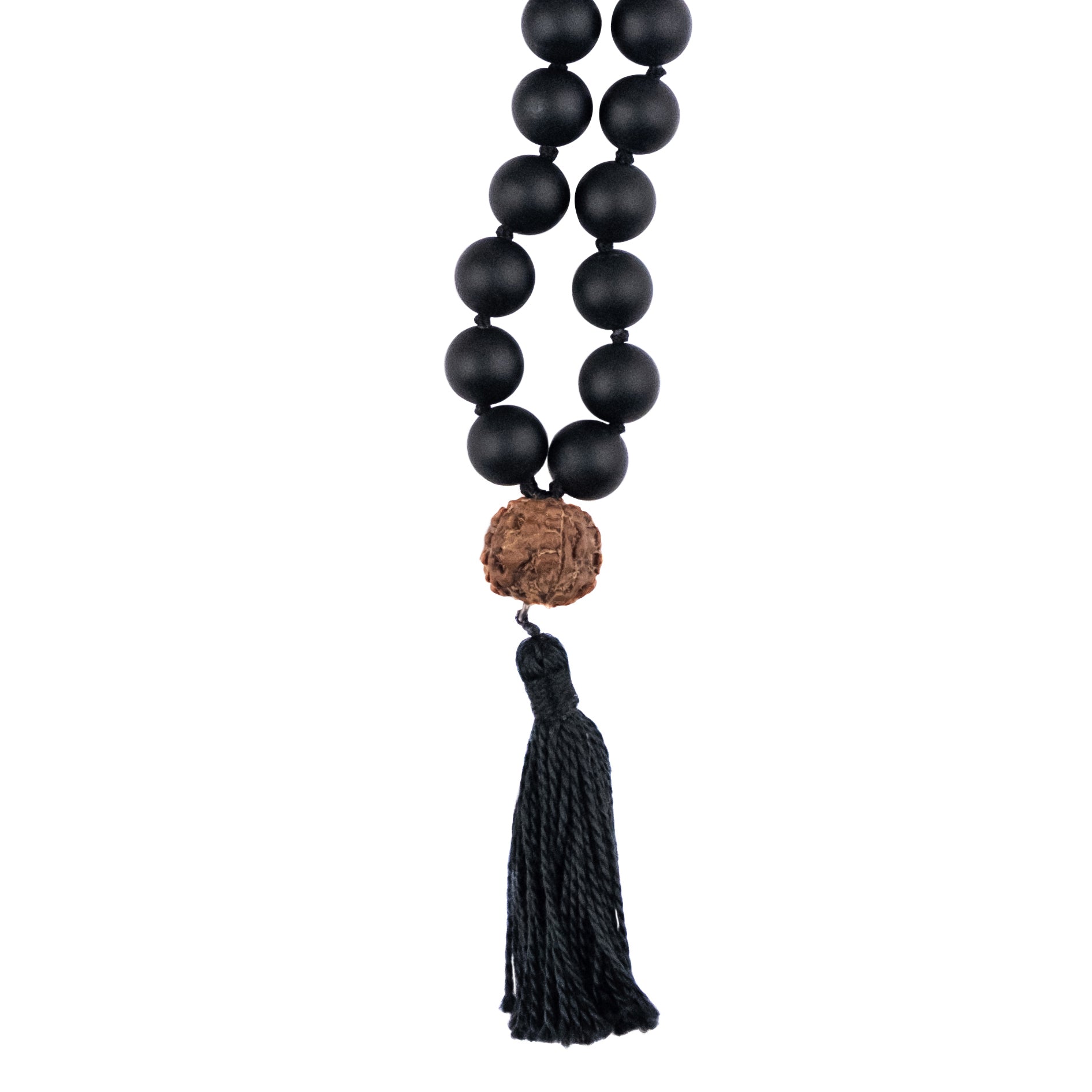 rudraksa bead with black tassel of a mala necklace on white background