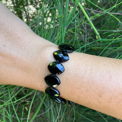onyx on adjustable string bracelet on wrist