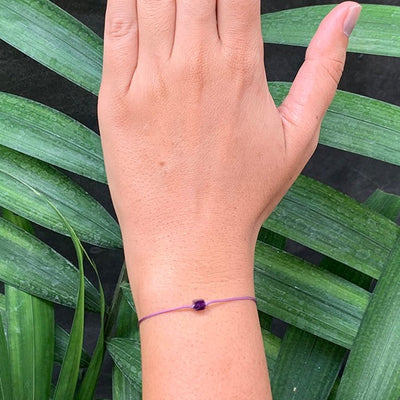 Amethyst, Hematite 4mm on purple adjustable artificial string bracelet on wrist front side