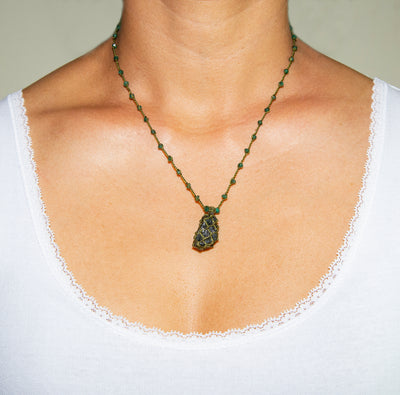 Apetite Pendant Necklace with small Aventurine beads, and raw green Apatite pendant caged with twisted artificial thread on model in white top