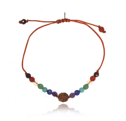 fourteen multi colored beads on red string bracelet with rudraksha on white background