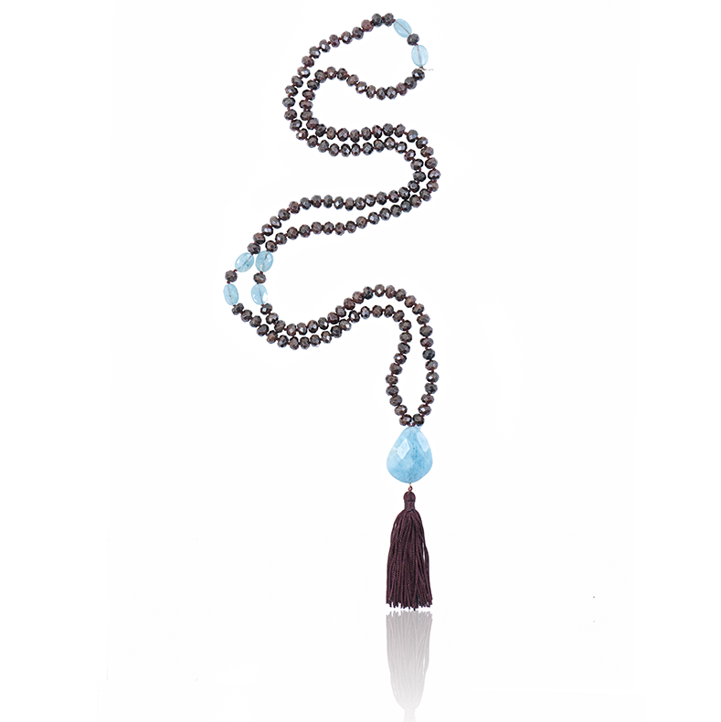 mala necklace with 7x4mm Garnet Aquamarine Pendant with dark red tassel on white background